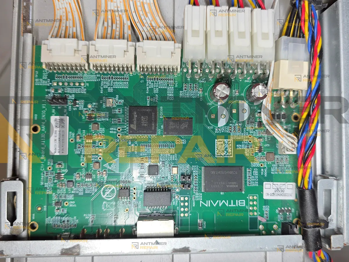 Antminer AML control board installed in the miner with three hashboard ribbon cables, four fan leads and the power harness connected