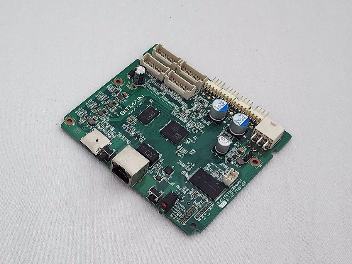 Antminer Xilinx Zynq control board, component side, with the microSD slot beside the Ethernet jack and the white hashboard ribbon headers along the opposite edge